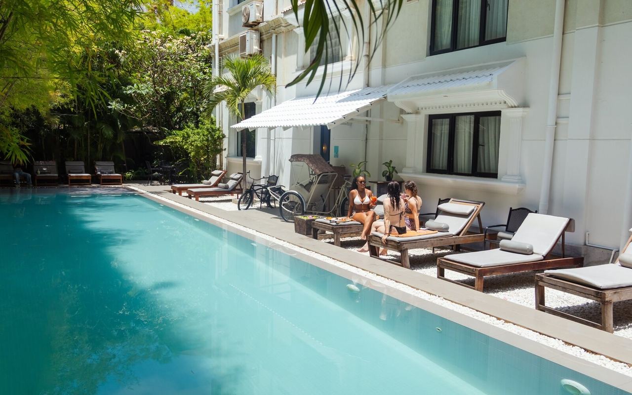 The lap pool and loungers at White Mansion, beside the mansion wall